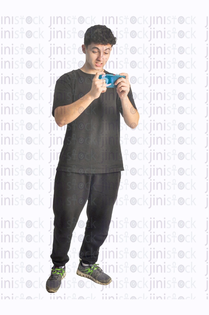 A teen boy playing on a mobile phone an aggressive game