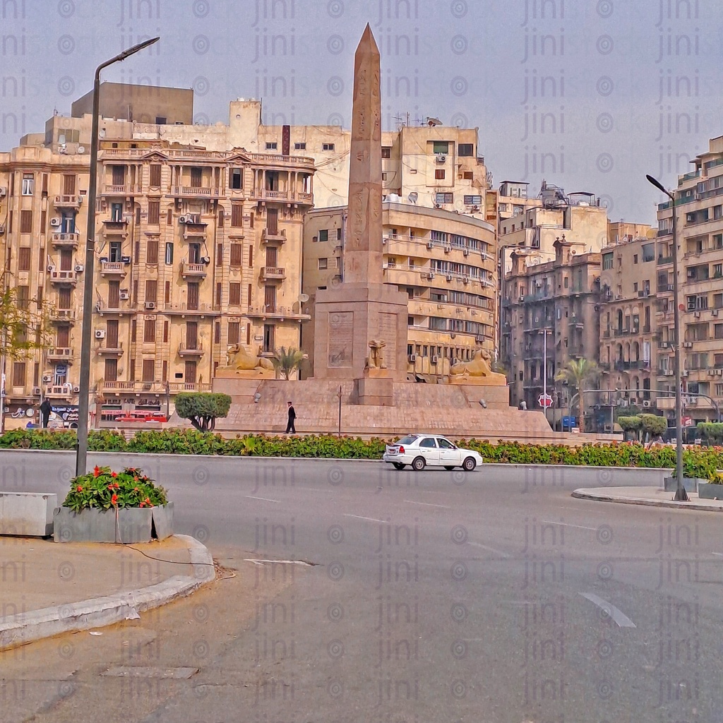 The obelisk,and Rams in Tahrir Square, Cairo, Egypt, and the Street were empty of cars, and are used as a background for designs on Cairo streets