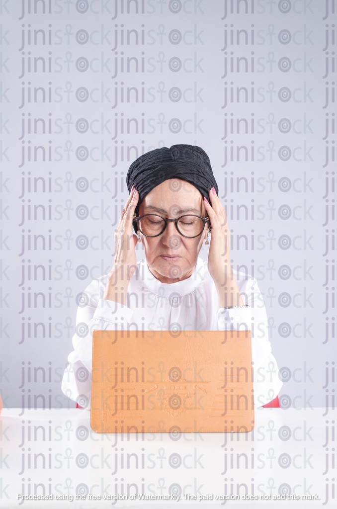 Old Egyptian woman Teacher or school principal with headache