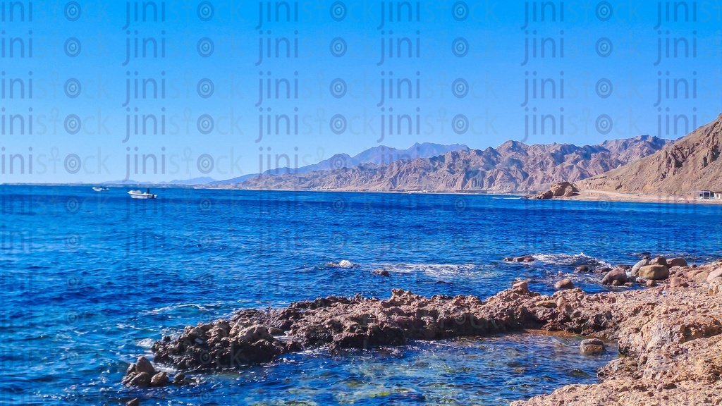 A Beach, rocks, and mountains in Dahab, south Sinai, Egypt