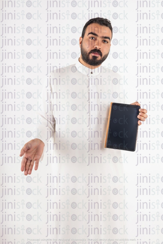 a stock image on isolated background of a khaliji saudi man from gulf with tablet