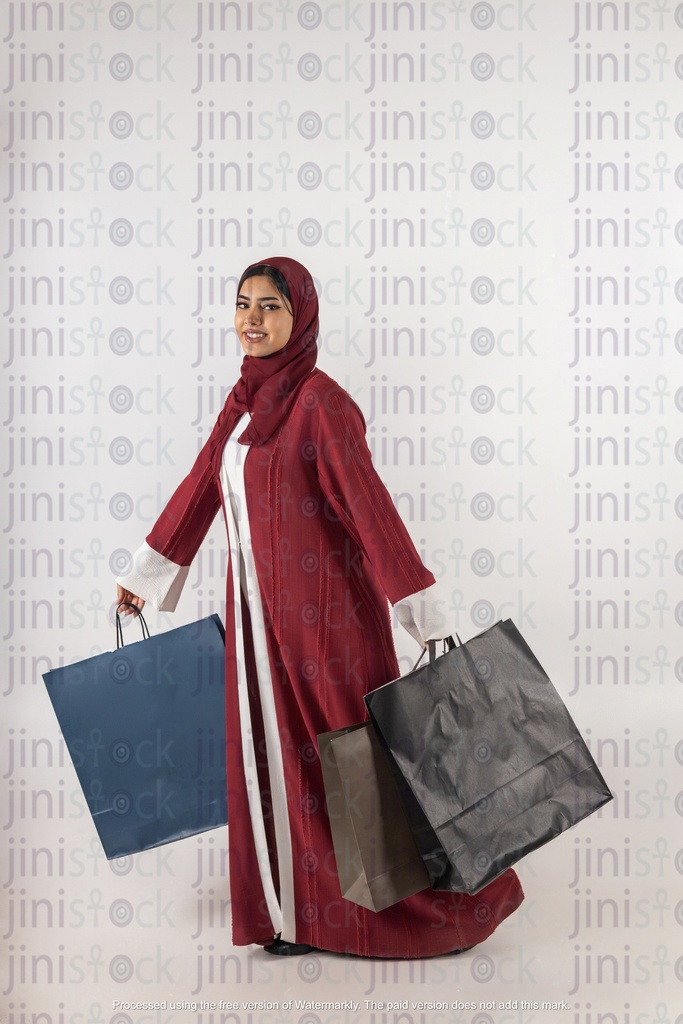 a  khaliji saudi woman from gulf with shopping bags stock image with high quality on isolated background