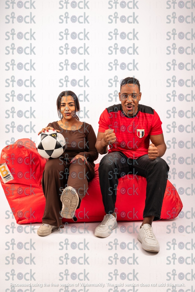 Young man and woman who are football fans