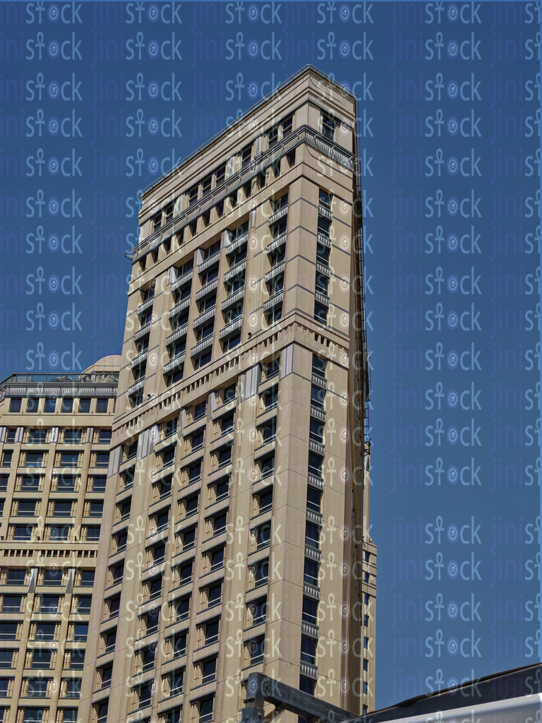 A towering tower shines under the clear Cairo sky 