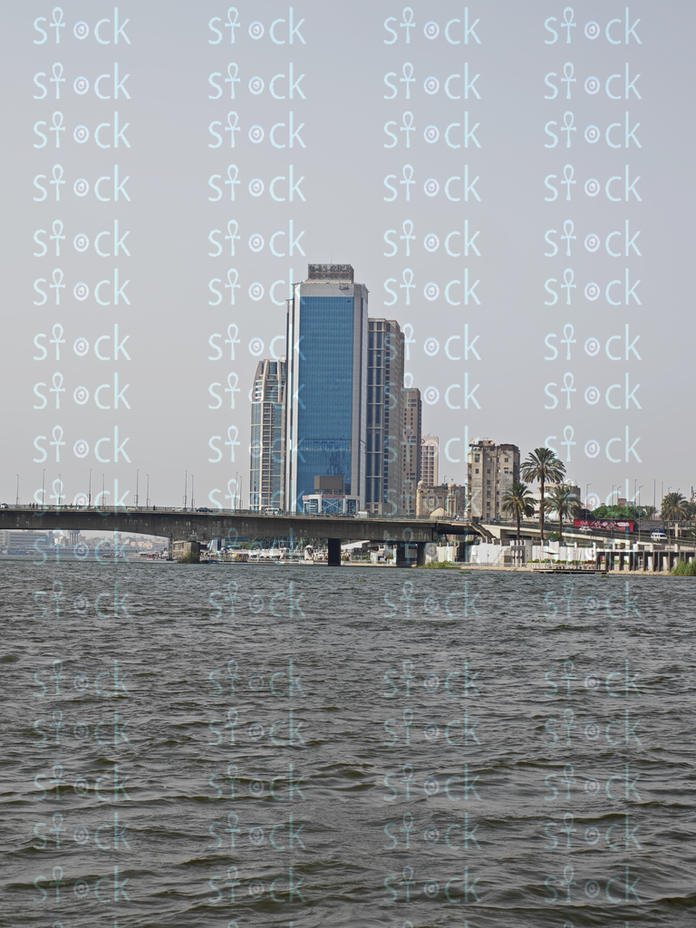 The Nile embraces the bridge in a calm atmosphere during the day