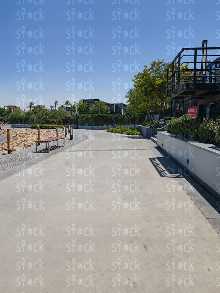 Blue sky above mall wall 