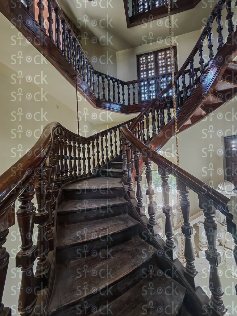 Heritage staircase, textured stone walls