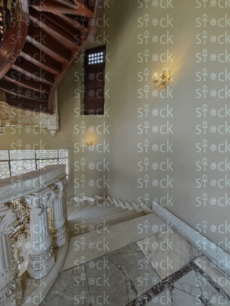 Sunlit marble stair landing