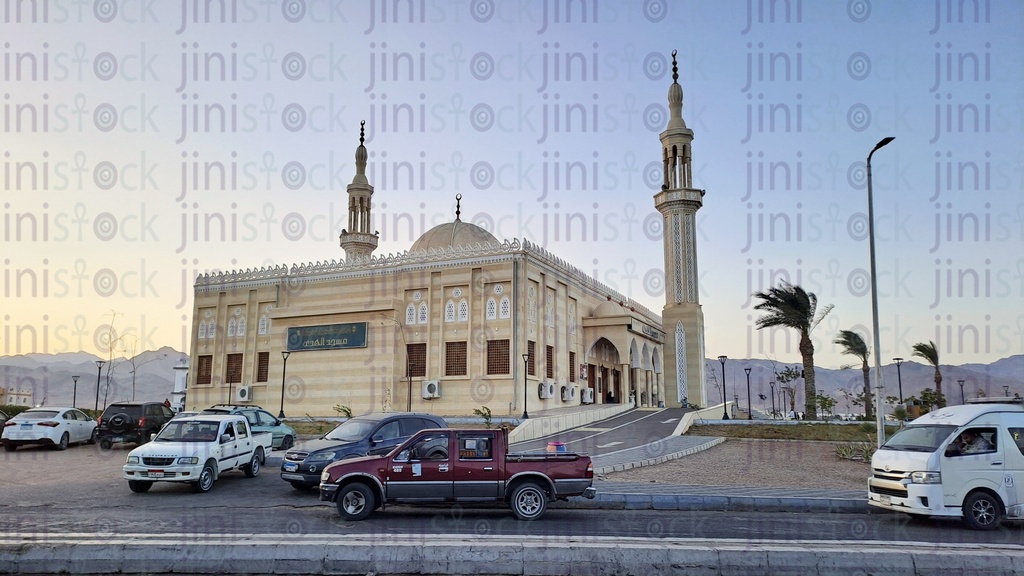 A street in Dahab, South Sinai, with a mosque or a large mosque in the background as the backdrop for the designs.