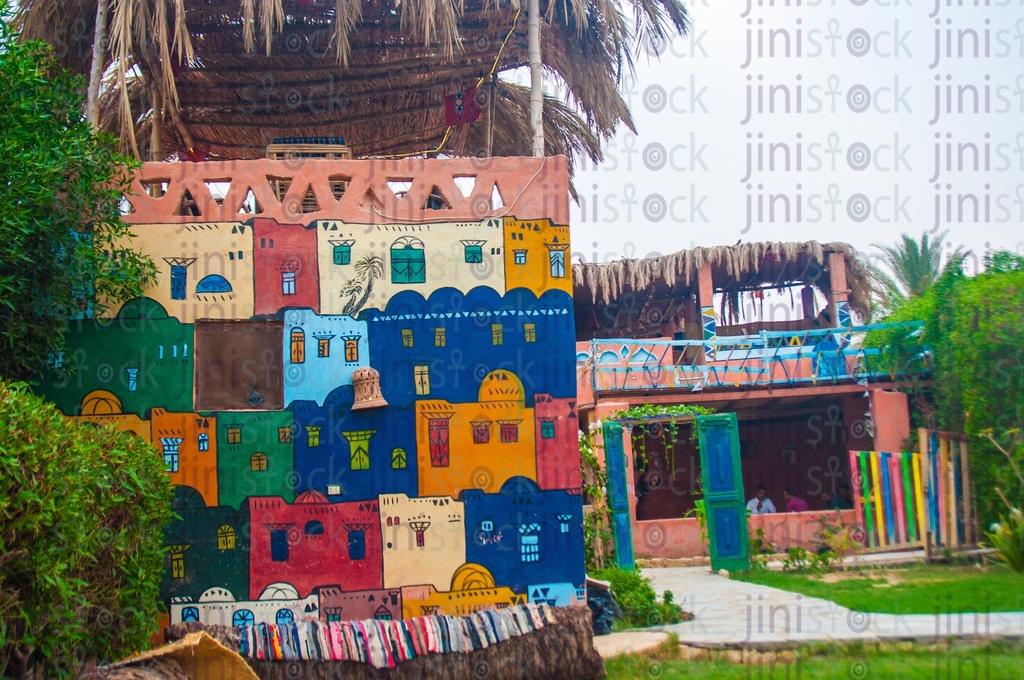 A building has Nubian drawings on it and has a rural style
