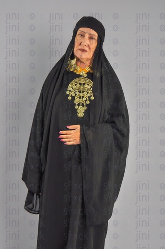 An upper Egyptian woman or woman from the Egyptian countryside putting her hand on her stomach or suffers from stomach or abdominal pain