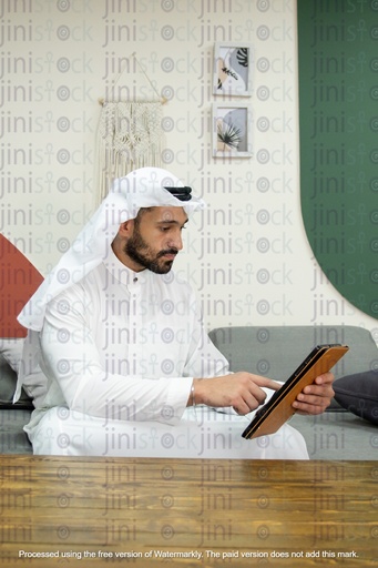Saudi young man working on iPad