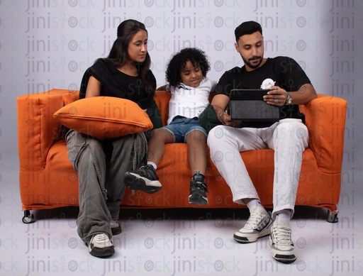 egyptian family sitting on the couch father mother son