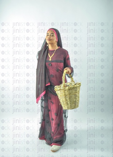 An Egyptian Farmer Nubian Egyptian girl wearing Nubian clothes holding a basket in her hand for putting vegetables or fruits