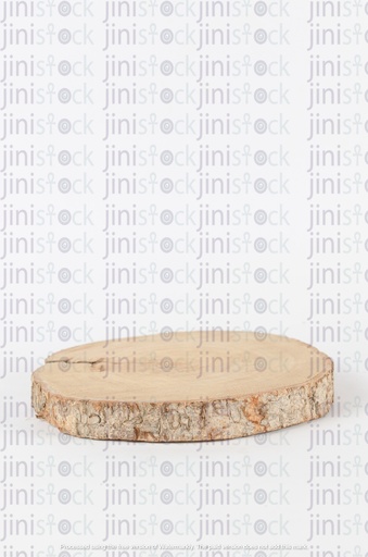 A circular tree trunk resting on a table - desk 