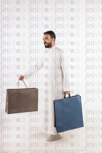a stock image of a khaliji man with shopping bags