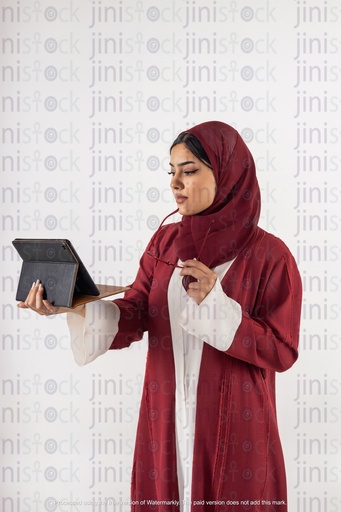saudi khaliji woman working and looking at the ipad