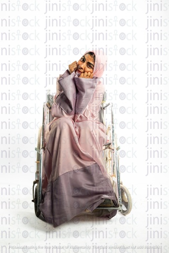 saudi khaliji woman from the gulf on a wheel chair disabled and smilling to the camera