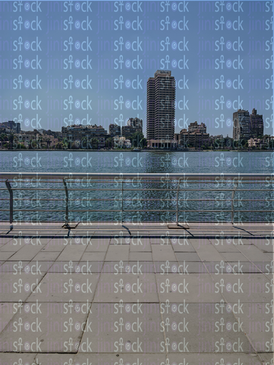 The walkway overlooks the wide Nile 