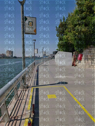 The wall of the Egyptian people's walkway next to the trees and the Nile