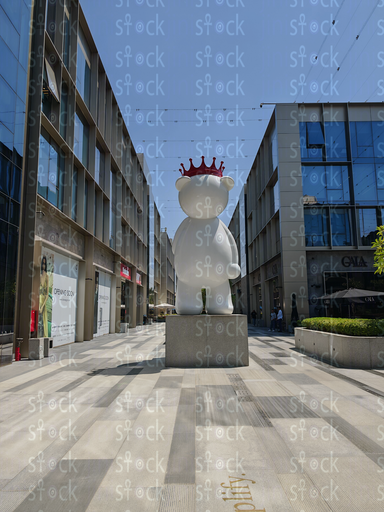 A huge statue of a white bear wearing a red crown 