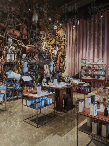 Beauty products in front of an art wall