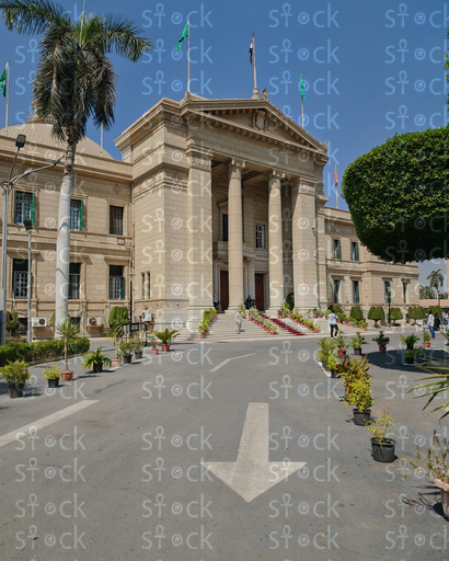 The road leading to the Cairo University dome building is decorated with flower pots