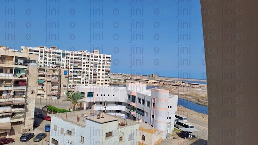 High angle of the sea and buildings in a street in Port Fouad in Port Said Egypt